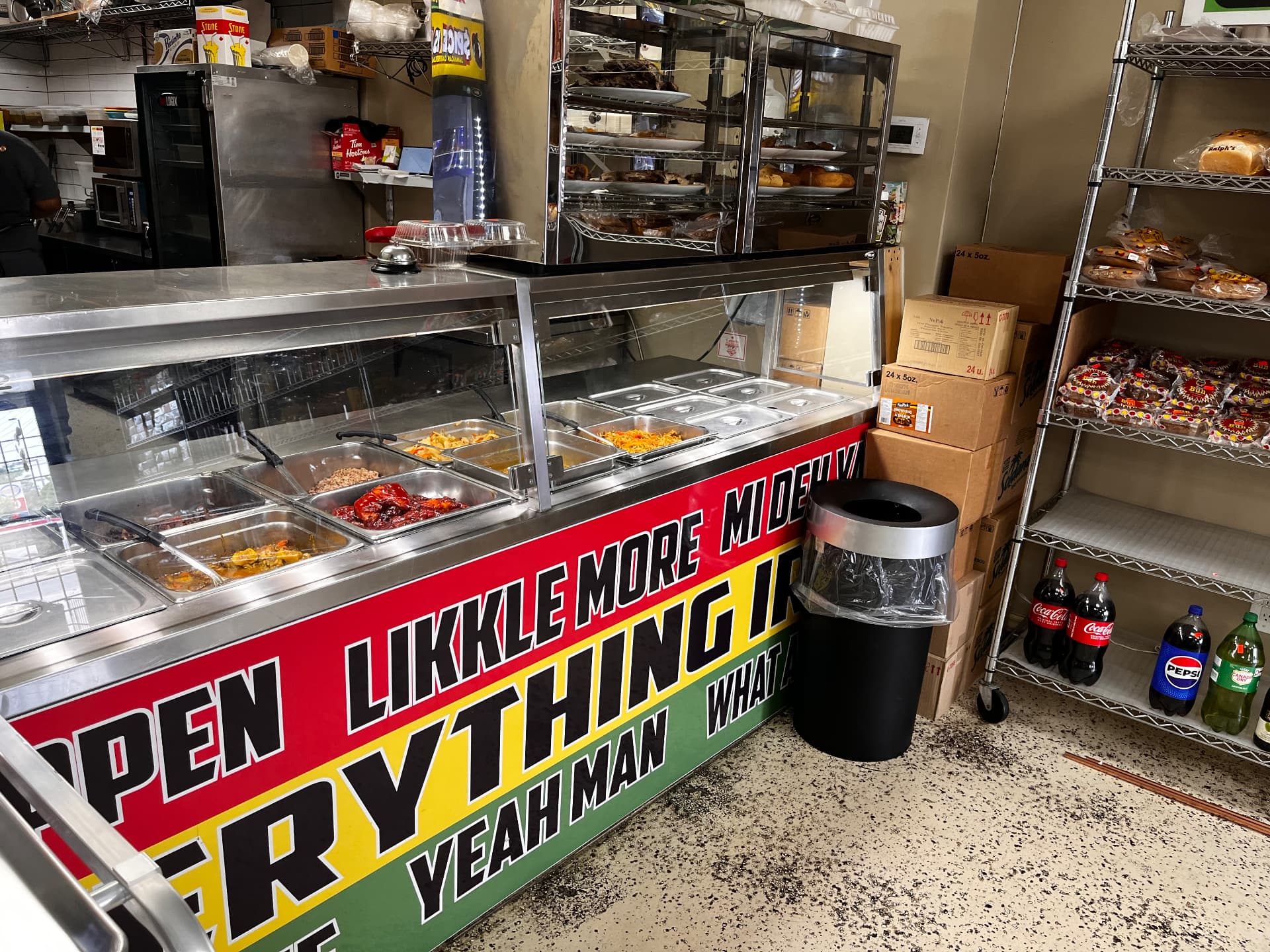 Hot food steam table with curry, jerk and stew dishes